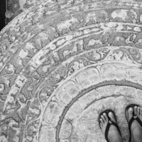 stepping on the sandakada pahana (moonstone) at srilanka